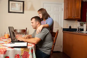 Two people at a computer